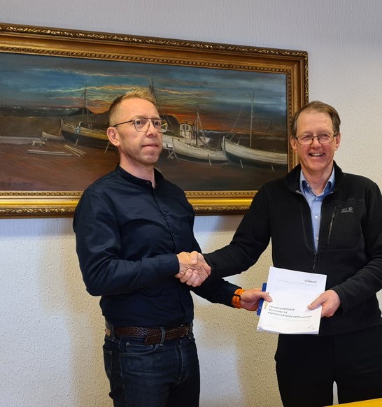 Signing of contract and shaking hands